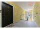 Condo entrance hall with textured walls, outdoor view, and lighting fixtures, creating a welcoming space at 10205 Courtney Palms Blvd # 304, Tampa, FL 33619
