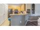 Efficient kitchen features a breakfast bar, ample counter space, and modern appliances, perfect for casual dining at 10205 Courtney Palms Blvd # 304, Tampa, FL 33619