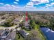 Aerial view of a suburban community next to a body of water showcasing the neighborhood layout at 1042 Trafalgar Dr, New Port Richey, FL 34655