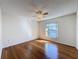 Bedroom featuring hardwood floors, ceiling fan, and natural light at 1042 Trafalgar Dr, New Port Richey, FL 34655