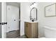 Bathroom with modern vanity featuring a marble countertop and black accents at 11338 Yellowwood Ln, Port Richey, FL 34668