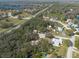 Overhead view of a home near a green space, showing its proximity to local roads and other homes at 12005 Wren Ct, New Port Richey, FL 34654
