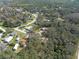 Scenic aerial view of a residential neighborhood with mature trees and well-maintained streets at 12005 Wren Ct, New Port Richey, FL 34654