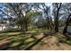 Wide shot of the yard with mature trees at 12005 Wren Ct, New Port Richey, FL 34654