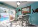 Eat-in dining area with sliding glass doors to the pool area and fish decor on the walls at 12005 Wren Ct, New Port Richey, FL 34654
