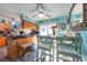 Open-concept kitchen with breakfast bar seating and seamless access to the dining area with natural light at 12005 Wren Ct, New Port Richey, FL 34654