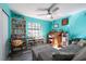 Inviting living room featuring a large window, comfortable seating, and ample bookshelf space at 12005 Wren Ct, New Port Richey, FL 34654
