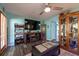 Relaxing living room with a large TV and comfortable seating for entertainment and leisure at 12005 Wren Ct, New Port Richey, FL 34654