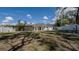 Large, grassy backyard with a white fence, offering plenty of space for outdoor activities and privacy at 1316 W Hiawatha St, Tampa, FL 33604