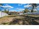 Expansive backyard showcasing a patio, and ample space for recreation, all enclosed by a pristine white fence at 1316 W Hiawatha St, Tampa, FL 33604