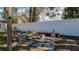 A backyard space with a paver base sitting area and bench along the rear fence at 1316 W Hiawatha St, Tampa, FL 33604