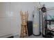 Basement area with water heater and stool for easy access for maintenance at 1316 W Hiawatha St, Tampa, FL 33604