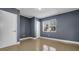 A cozy bedroom featuring neutral walls, tile flooring, closet, and natural light at 1316 W Hiawatha St, Tampa, FL 33604