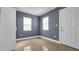 A modern bedroom with neutral walls, tile flooring, and bright natural light at 1316 W Hiawatha St, Tampa, FL 33604