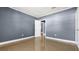 A bedroom featuring neutral walls, tile flooring, closet, and natural light at 1316 W Hiawatha St, Tampa, FL 33604
