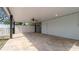 Spacious covered patio featuring ceiling fan, recessed lighting and tiled flooring, perfect for entertaining or relaxing outdoors at 1316 W Hiawatha St, Tampa, FL 33604