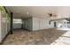 Well-designed outdoor covered patio area featuring a ceiling fan and access to the fenced in yard at 1316 W Hiawatha St, Tampa, FL 33604