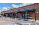 Brick commercial building featuring a variety of storefronts, complete with ample parking at 1316 W Hiawatha St, Tampa, FL 33604