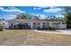 Charming single-story home features a well-manicured lawn and attached garage at 1316 W Hiawatha St, Tampa, FL 33604