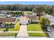 Inviting single-story home featuring a well-manicured lawn, neutral exterior, and an attached two-car garage at 16122 Northglenn Dr, Tampa, FL 33618