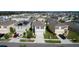Aerial view of a suburban neighborhood with well-maintained lawns and modern two-story homes at 16849 Trite Bend St, Wimauma, FL 33598
