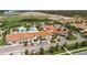 Aerial view of the community clubhouse, pool, and surrounding development at 16849 Trite Bend St, Wimauma, FL 33598