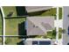 Aerial view of home with a large fenced backyard and a well-maintained roof at 16849 Trite Bend St, Wimauma, FL 33598