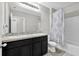 Bathroom featuring double sinks, a large mirror, and a shower-tub combination at 16849 Trite Bend St, Wimauma, FL 33598