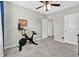 Bedroom featuring a ceiling fan, a window, and carpeted floors at 16849 Trite Bend St, Wimauma, FL 33598