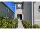 Charming home with a welcoming front entrance and walkway lined with lush landscaping at 16849 Trite Bend St, Wimauma, FL 33598