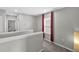 Upstairs hallway featuring natural light and neutral-colored walls and carpet at 16849 Trite Bend St, Wimauma, FL 33598