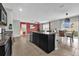 Open floorplan with integrated eat-in kitchen, dining and living areas with modern design and vinyl floors at 16849 Trite Bend St, Wimauma, FL 33598