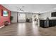 Open floorplan featuring luxury vinyl plank flooring, ceiling fan, and integrated kitchen at 16849 Trite Bend St, Wimauma, FL 33598