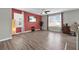 Open floorplan with luxury vinyl plank flooring, large windows, and modern design elements at 16849 Trite Bend St, Wimauma, FL 33598