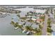 Waterfront neighborhood aerial view showcasing multiple properties with private docks, boat access, and beautiful water views at 17404 1St E St, Redington Shores, FL 33708