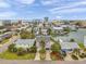 Stunning waterfront home with lush landscaping, a spacious driveway, and beautiful city views at 17404 1St E St, Redington Shores, FL 33708