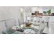 Dining area features a modern table setting, bright lighting, and stylish decor, perfect for elegant dining experiences at 17404 1St E St, Redington Shores, FL 33708