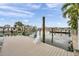 A well-maintained dock with water access and stunning view of the canal and neighborhood at 17404 1St E St, Redington Shores, FL 33708