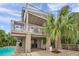 Multi-level home featuring a pool, covered patio, and multiple decks for enjoying the outdoors at 17404 1St E St, Redington Shores, FL 33708