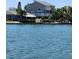 Waterfront two-story home featuring a private dock and a beautiful view of the serene open water at 17404 1St E St, Redington Shores, FL 33708