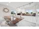 Bright kitchen boasting white cabinets, stainless appliances, a marble island, and a tropical view from the window at 17404 1St E St, Redington Shores, FL 33708
