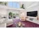Bright living room with balcony access, modern decor, ideal for relaxation and enjoying beautiful scenery at 17404 1St E St, Redington Shores, FL 33708