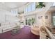 Bright living room with access to the outdoor balcony, modern decor, perfect for relaxation and enjoying the view at 17404 1St E St, Redington Shores, FL 33708