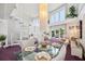 Bright living room with a spiral staircase, modern decor, and open floor plan, great for entertaining and comfortable living at 17404 1St E St, Redington Shores, FL 33708