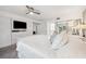 A bright main bedroom with built in cabinets, shelving and drawers and king bed at 17404 1St E St, Redington Shores, FL 33708