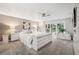 Serene main bedroom with large dresser, fan, and sliding glass doors to the outdoor balcony at 17404 1St E St, Redington Shores, FL 33708