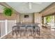 Covered outdoor bar area with seating and a TV, perfect for entertaining by the pool at 17404 1St E St, Redington Shores, FL 33708
