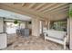 Wide angle shot of the outdoor living area with pavers and multiple seating options at 17404 1St E St, Redington Shores, FL 33708