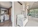 Covered patio with a stylish bench seat, exterior access, and views into a slate tiled half bathroom at 17404 1St E St, Redington Shores, FL 33708