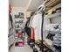 Walk-in closet with hanging racks, shelving, and ample storage space for clothing and accessories at 17404 1St E St, Redington Shores, FL 33708